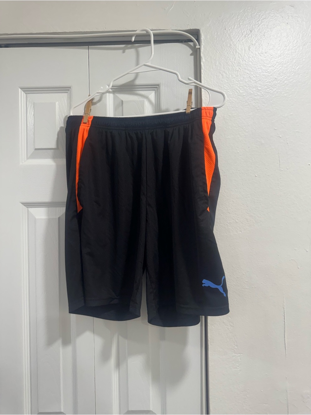 Puma Black Athletic Shorts with Orange Panels and Blue Logo